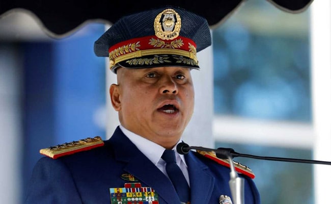 Police officer speaking at a podium