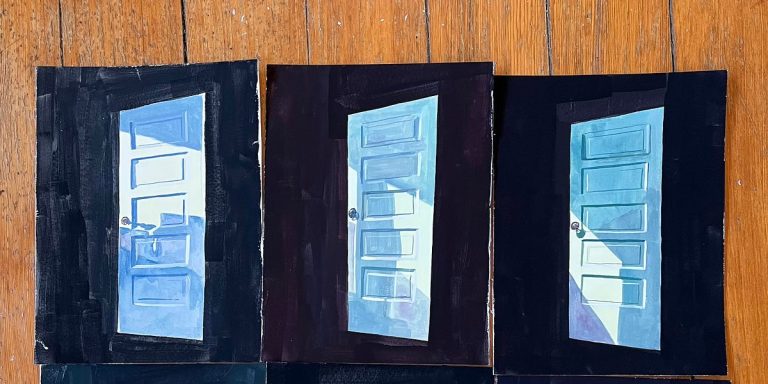 Three paintings of blue doors on wooden floor.