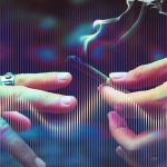 Hands passing a smoking joint, colorful background.